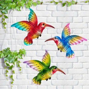 Colorful metal hummingbird wall hanging decor, vibrant garden and outdoor decoration detail.