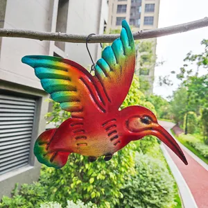 Colorful metal hummingbird hanging detail, outdoor garden decor craft, vibrant iron art.