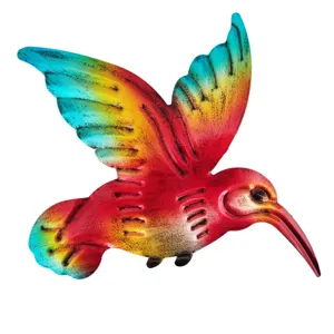 Detailed close-up shot of the colorful metal hummingbird wall art showing vibrant painted texture.
