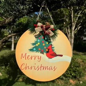 Wooden Christmas round hanging sign detail, festive tree and cardinal bird decor for holiday home.
