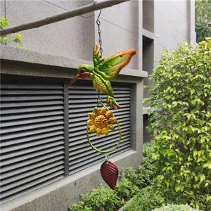 Detailed view of metal hummingbird wind chime hanging decor, outdoor garden ornament.