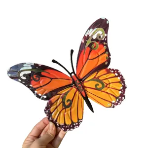 Colorful metal butterfly wall hanging art, vibrant iron decor for home and garden.