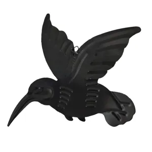 Metal hummingbird wall art detail, black iron hanging decor for garden and outdoor spaces.
