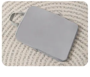 Grey fabric travel storage bag detail view, waterproof suitcase organizer for clothes.