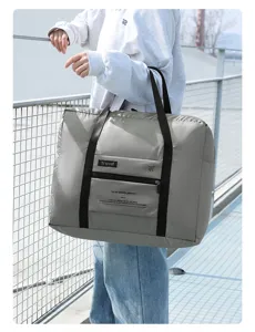 Foldable travel duffel bag with luggage sleeve, portable weekend bag for short trips.