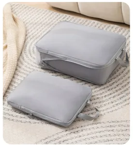 Detail view of grey travel storage organizer bag set showing waterproof fabric and zipper.