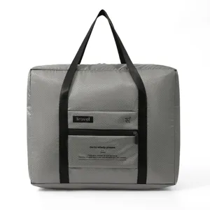 Foldable travel duffel bag with diamond pattern, portable luggage bag for business trips.