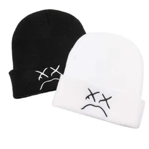 Winter warm knitted beanie hat with embroidery crying face design, soft black and white caps.