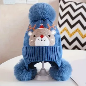 Kids winter knitted hat with cute reindeer pattern, warm earflap beanie and lovely pom poms.