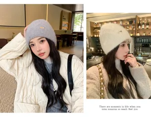 Close-up detail of cozy warm winter knit beanie hat, soft plush texture, stylish cafe scene look.
