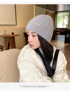 Winter fluffy knitted beanie for women, cozy warm wool hat with stylish metal decor chic style.