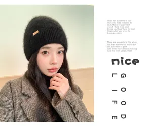 Women winter black fuzzy knitted beanie hat, warm soft wool cap for outdoor travel and daily wear.