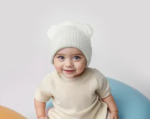 Detailed close-up view of the cozy knitted baby hat featuring cute bear ears design.