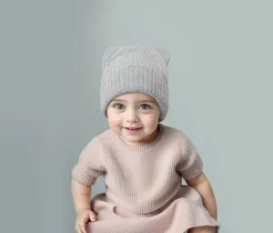 Baby bear beanie knit hat detail view, soft grey stretch winter cap for infants.