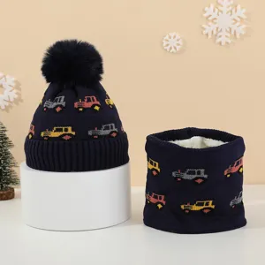 Detail view of children knit hat and scarf set with cute car pattern and warm fleece lining.
