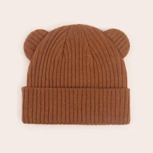Cute brown baby knit beanie with bear ears, soft winter hat detail for infants toddlers.