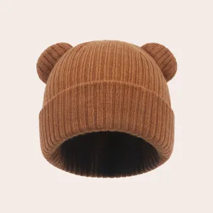 Infant brown knit beanie with cute bear ears, warm stretchy winter hat for babies and toddlers.