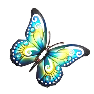 Detailed shot of the blue and yellow metal butterfly wall hanging with cutout acrylic design.