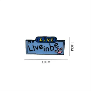 Close-up detail of the English slogan enamel pin with cute paw print and metal baking paint.