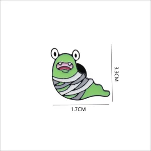 Close-up detail of cute Halloween mummy slug enamel pin, metal lapel badge decoration.