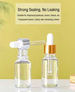 Detail of 30ml clear glass dropper bottles for cosmetic serum with gold and silver caps
