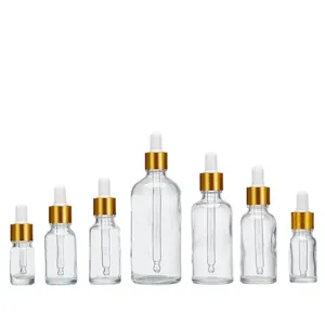 Clear glass essential oil dropper bottles in various sizes on white background