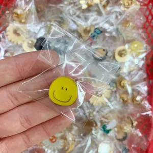 Wholesale yellow smiley face enamel pin metal brooch badge cute clothing accessories.