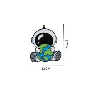 Cute cartoon astronaut holding earth enamel pin detail view, metal brooch accessory