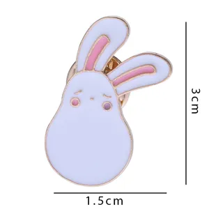 Detailed shot of cute rabbit enamel brooch, featuring metal pin and pink details for accessories.