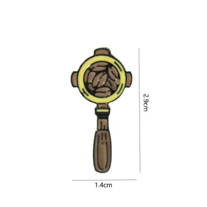 Detailed view of a vintage coffee portafilter enamel pin, measuring 2.9x1.4cm. Cute coffee badge.