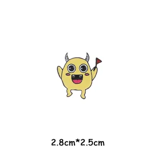 Detailed shot of the cute Halloween devil cartoon monster enamel pin, showing alloy texture.