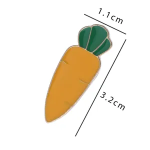 Detail shot of the cute carrot enamel pin showing its compact size and glossy alloy finish.