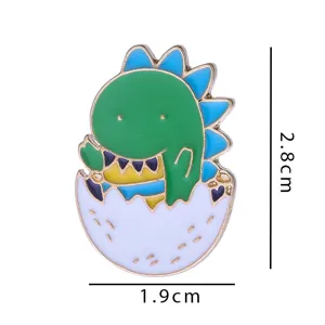 Close-up details of the cute green dinosaur eggshell alloy brooch, fine craftsmanship.