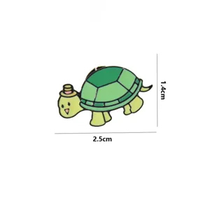 Detailed view of cute cartoon turtle enamel pin highlighting its compact size and design.