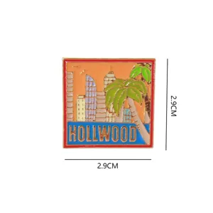 Enamel pin badge featuring Hollywood city and palm tree design, metal souvenir collectible.