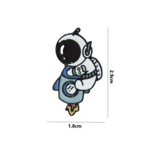 Astronaut enamel pin badge detail close-up metal craft, cute space theme accessory.