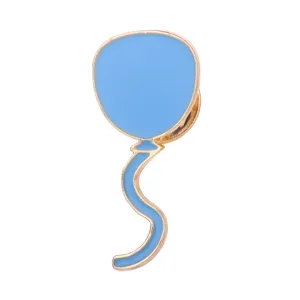 Close-up detail view of a cute light blue balloon enamel pin with gold metal trim badge.
