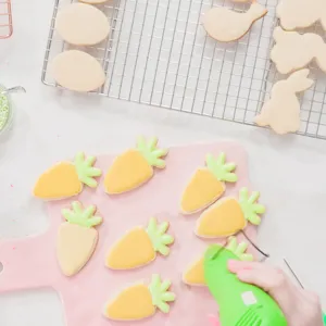 Stainless steel Easter cookie cutter set, includes carrot, rabbit, and egg shapes for baking.