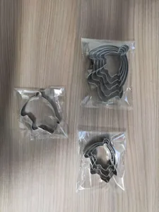Set di tagliaforbici biscotti maiale in acciaio inox dettaglio, strumento fai da te.