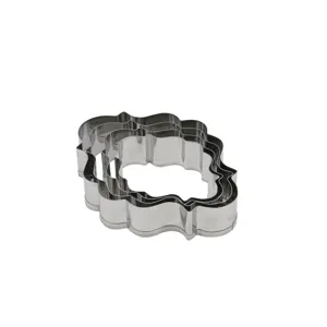 Stainless steel cookie cutter detail view, fancy scalloped plaque shape baking mold set.