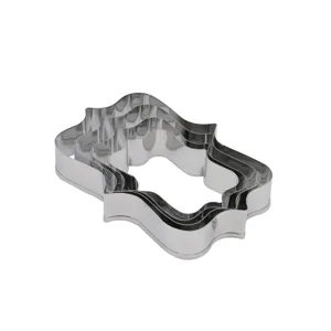 Stainless steel cookie cutter set detail showcasing decorative plaque and frame shapes.