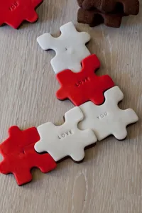 Stainless steel puzzle cookie cutter detail showing cute embossed letters.