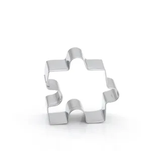 Stainless steel puzzle cookie cutter detail, premium metal baking mold for fondant and biscuits.