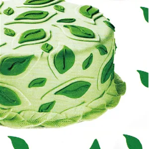 Detailed close-up of green leaf textured cake decoration, ideal for professional baking.