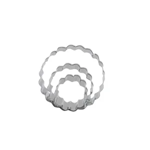Stainless steel nested round scalloped cookie cutters, detailed view of baking mold tools.