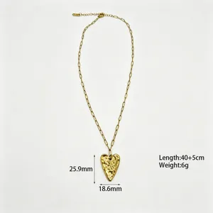Gold stainless steel paperclip chain necklace with textured irregular heart pendant for women.