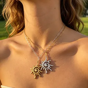 Stainless steel sun pendant necklaces detail view, elegant layered paperclip chain.