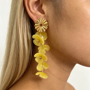 Fashion long flower drop earrings with golden metal top and translucent yellow resin petals.