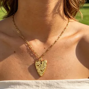 Gold stainless steel heart pendant necklace detail, stylish paperclip chain clavicle jewelry.