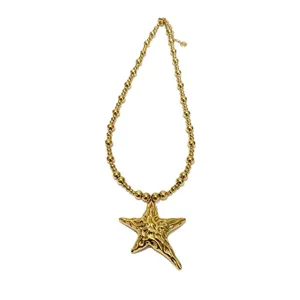 Gold stainless steel beaded necklace with exaggerated irregular starfish pendant for women.